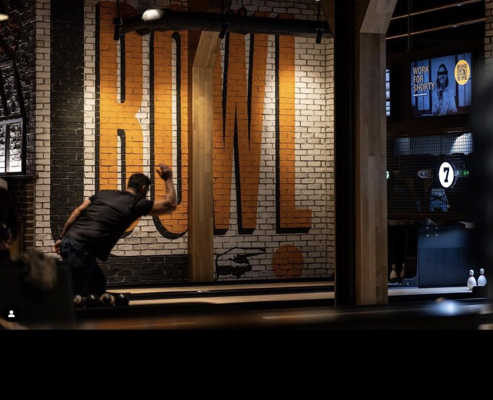 Bowling lanes and mural in play